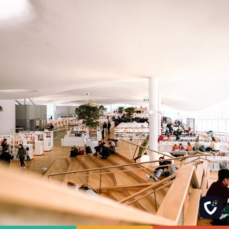 Contemporary library interior filled with people reading and relaxing in a bright and open space