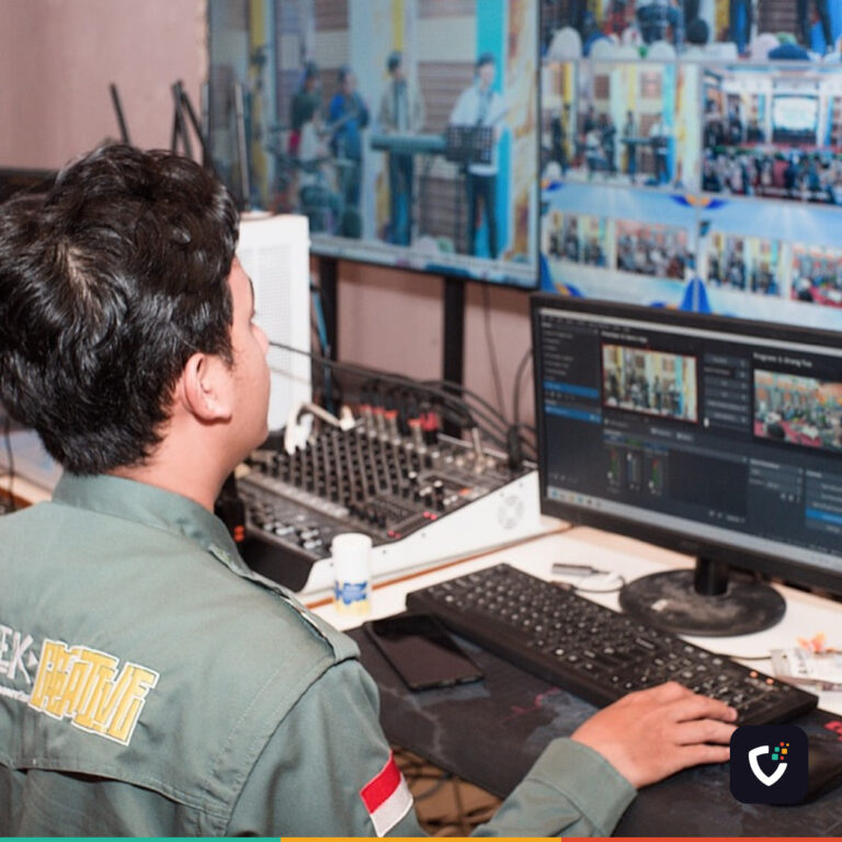 An operator watching a wall of monitors
