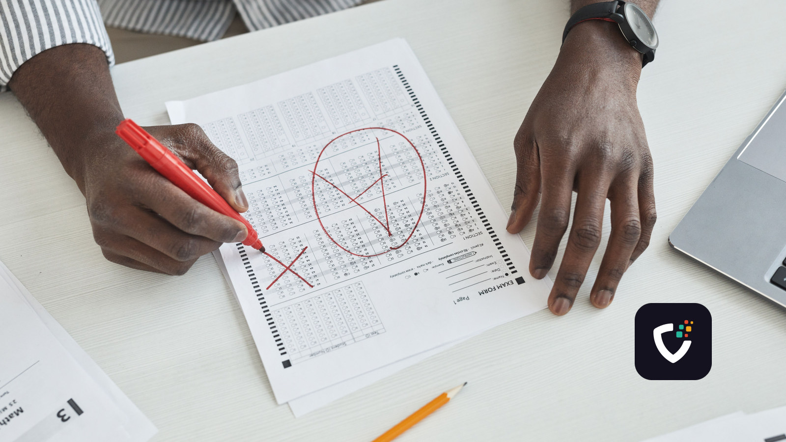 Hands marking a test paper in red pen, a tick circled and crosses beside the answers.